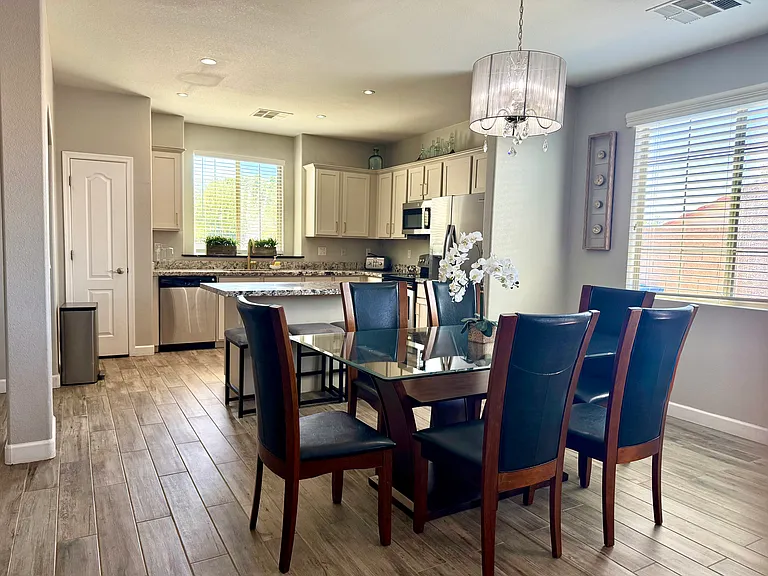 DINING AREA AND KITCHEN WITH BREAKFAST BAR