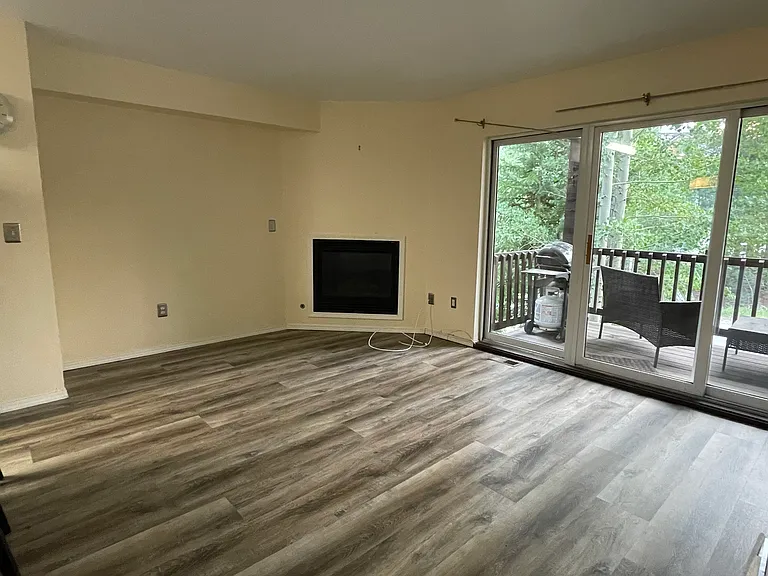 Spacious lounge with new flooring and gas fireplace