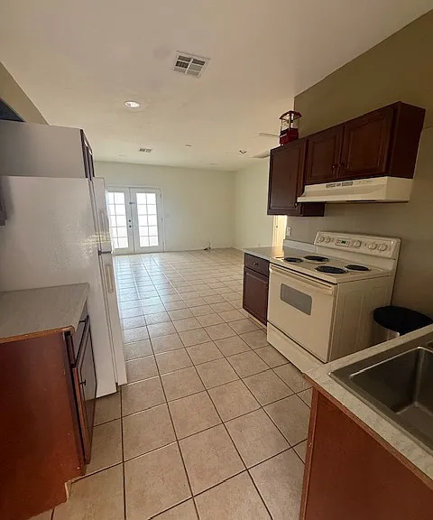 Kitchen, leading to open living area