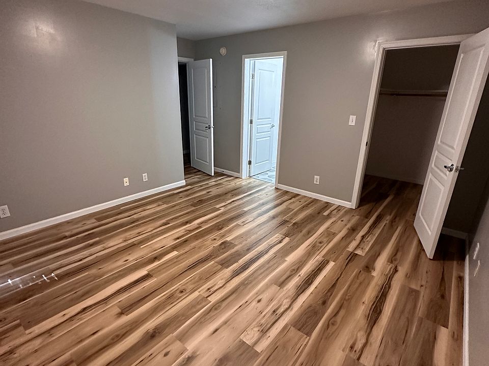 Bedroom with walk in closet and en suite bath