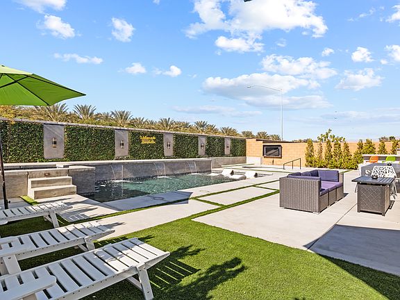 Enjoy the sun rays from one of the four poolside loungers.