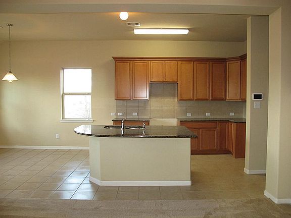  This FABULOUS gourmet kitchen features GRANITE counter tops, 42" Birch cabinets, ceramic tile flooring &  backsplash and will be finished out with black appliances!