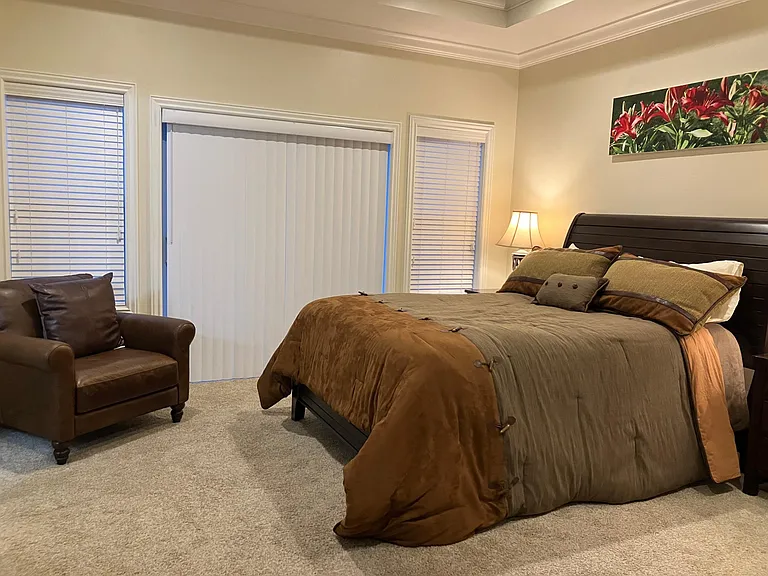 Master bedroom features a new Kingsdown queen bed, Smart TV, walk in closet, private walk-out deck with attached hot tub and pergola (to be installed before move-in). Enjoy luxury, privacy, and mountain views in this spacious retreat.