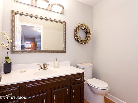 Main level powder room off of foyer.