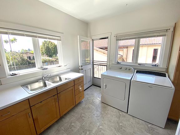Kitchen with in-unit washer/dryer and backyard access