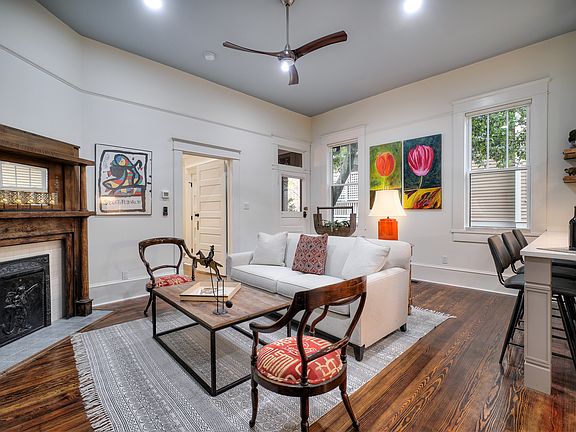 Living room with 11 foot ceilings and original hardwood floors
