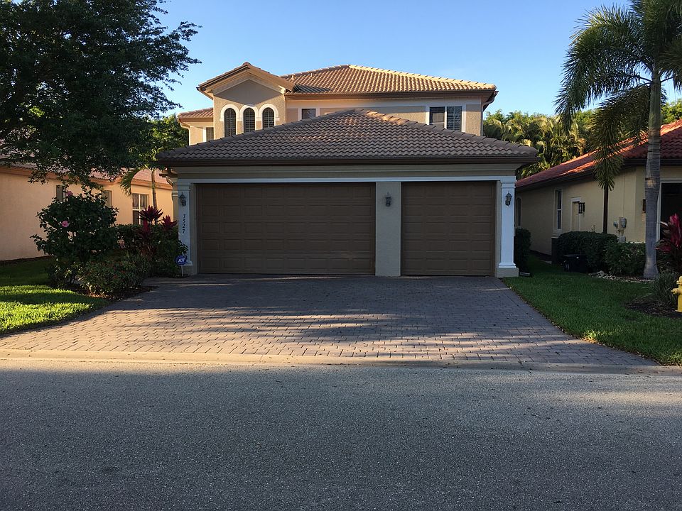 Front of house - notice shutters throughout