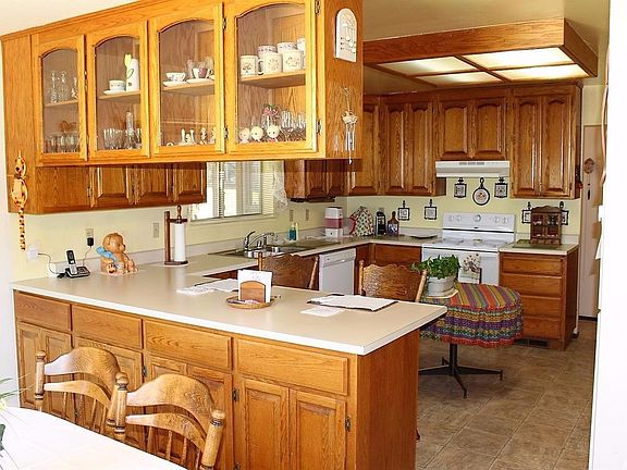 Kitchen has cabinets and counter space.