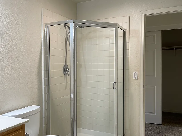 Common bathroom connected to the bedroom downstairs. Toilet was installed in 2019. Panasonic whisper green vent in all bathrooms. LED Recessed light installed in 2026.