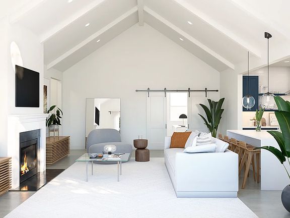Great room with vaulted ceiling and white painted beams