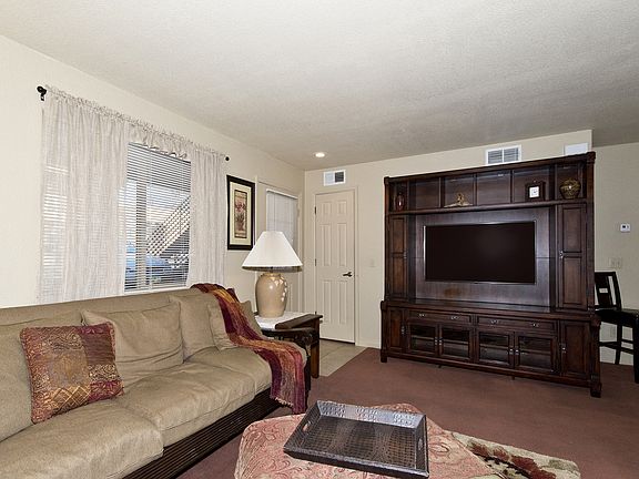 View of Living Room with Large TV Credenza and Entry.
(Furnishings Not Included)