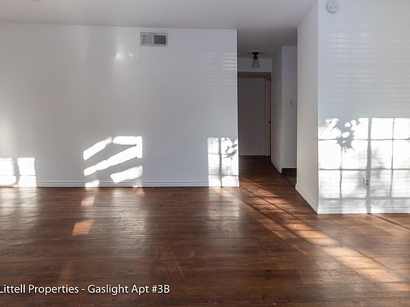 Living area with light wood flooring