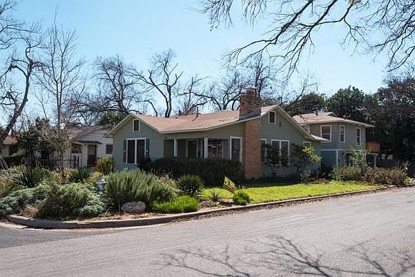 Picturesque craftsmen-style bungalow on large corner lot. In back ... cute one bath apartment upstairs plus office/studio downstairs with full bath.