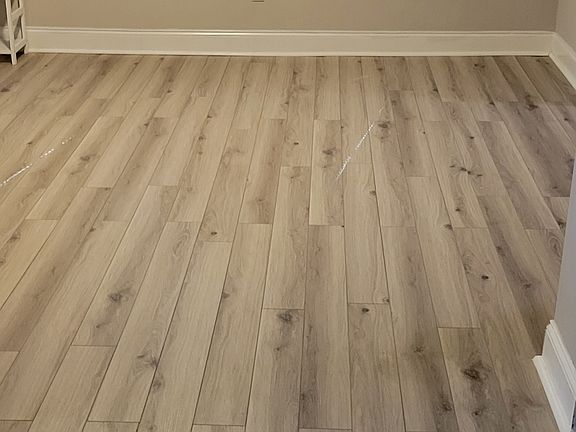 Living room area with beautiful new floors