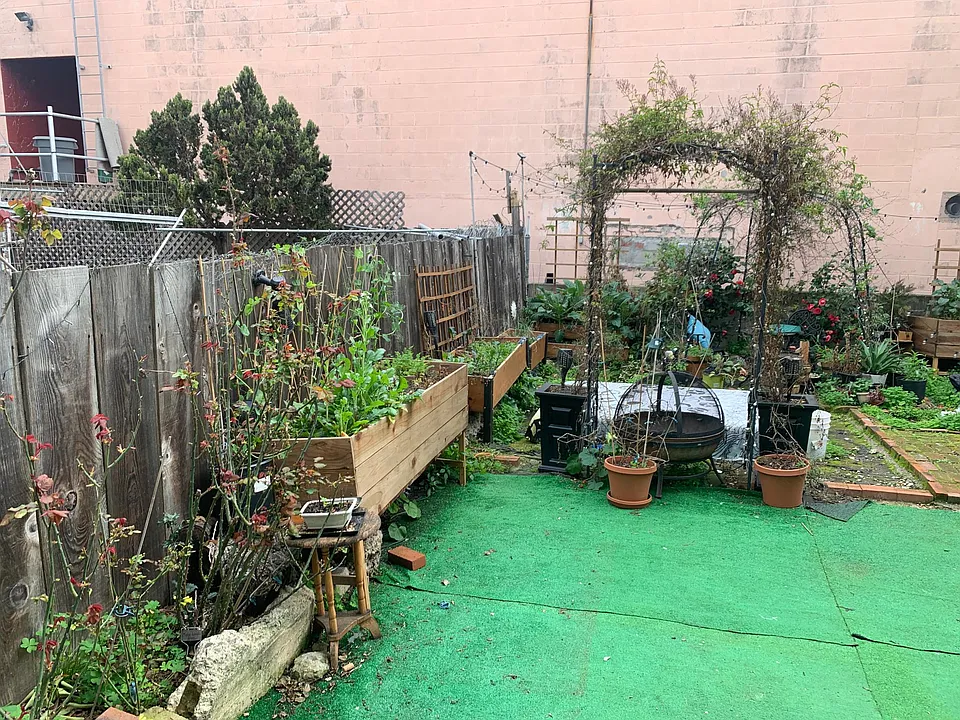 Wild and wonderful backyard with seating, gardening and nice open space.