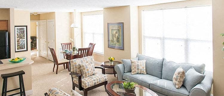 2-bedroom ranch style apartment with great room with kitchen with breakfast bar, living and dining areas, and large, bright windows