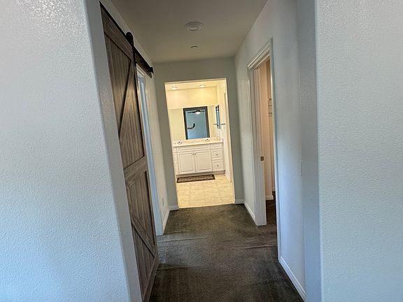 Hall leads to two walk-in closets, and personal / private bathroom.