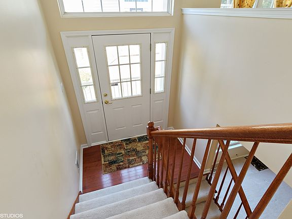 Looking down to front door from 2nd level.