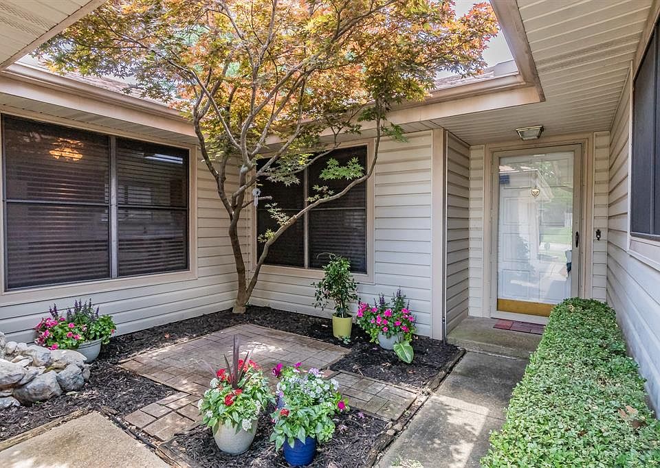 Front entry is tucked away in this tranquil courtyard. You can look out into it from the breakfast nook or family room.