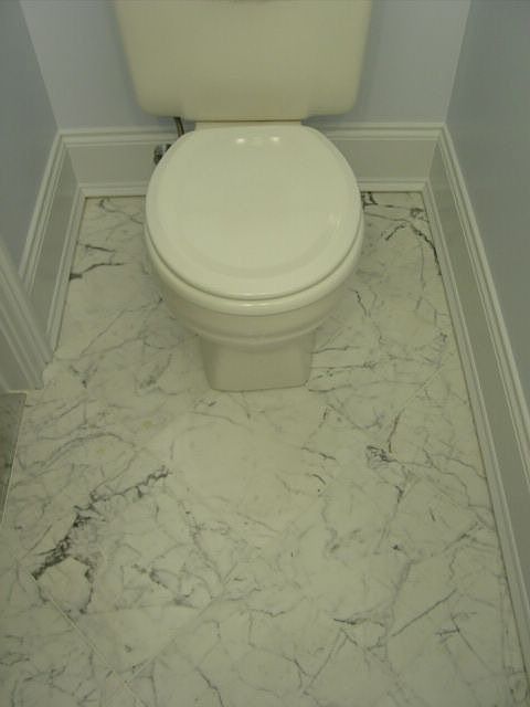 Statuary marble floor in powder room