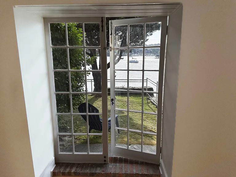 French doors with direct access to backyard right on Greenwich Harbor