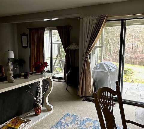 Living room view of water & golf course.