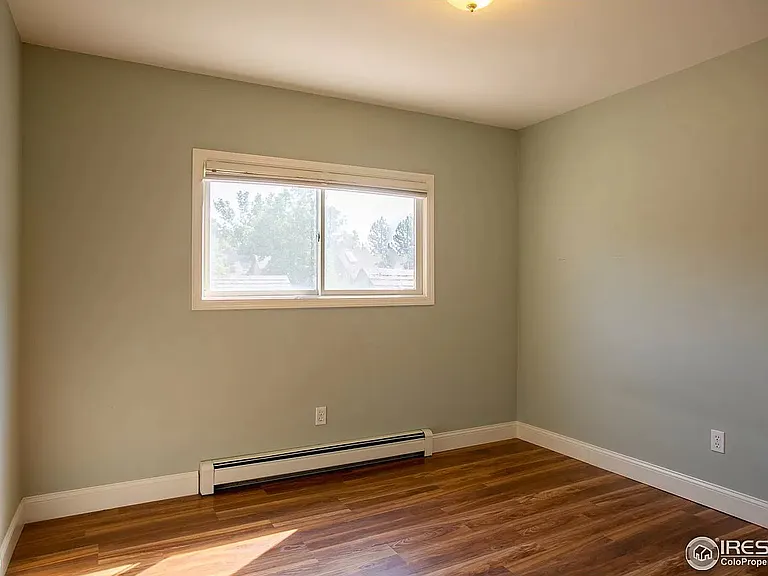 2nd floor medium size bedroom with walk in closet (not pictured). This bedroom now has a ceiling fan.