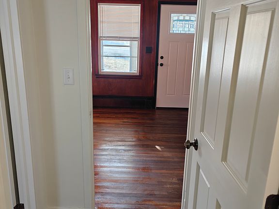 bath hall looking into living area/front porch door