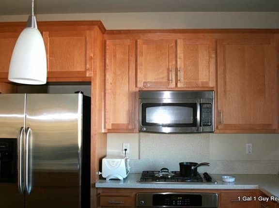 Beautiful kitchen with stainless appliances and quartz count