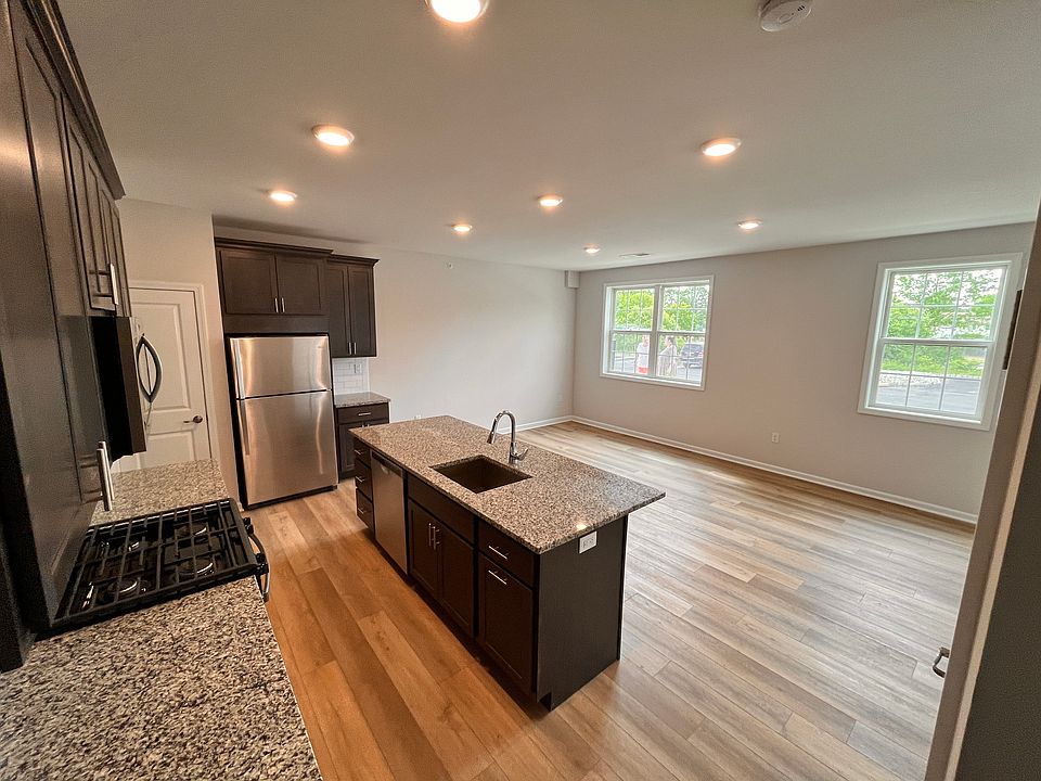 Open floor plan center island kitchen with granite countertops