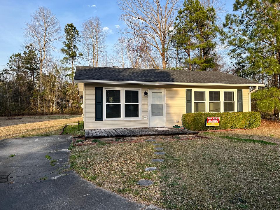 Front of home with deck.