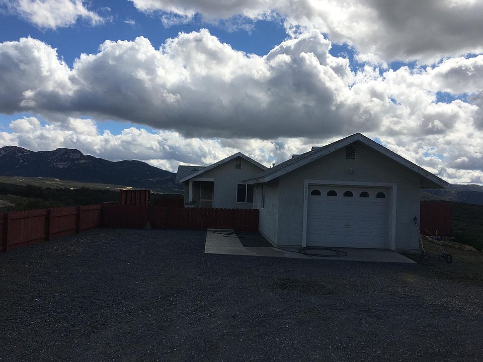 Finished interior Garage with automatic door, laundry hookups, and utility sink.