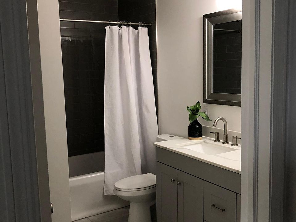 Double sink vanity, tub and shower. Door off primary bedroom also.
