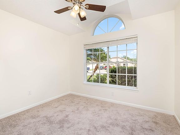 Front bedroom, vaulted ceilings, ceiling fan. Double door closet.