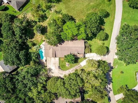 Nice Birdseye View showing the additional parking, mature trees, Pool and spa.