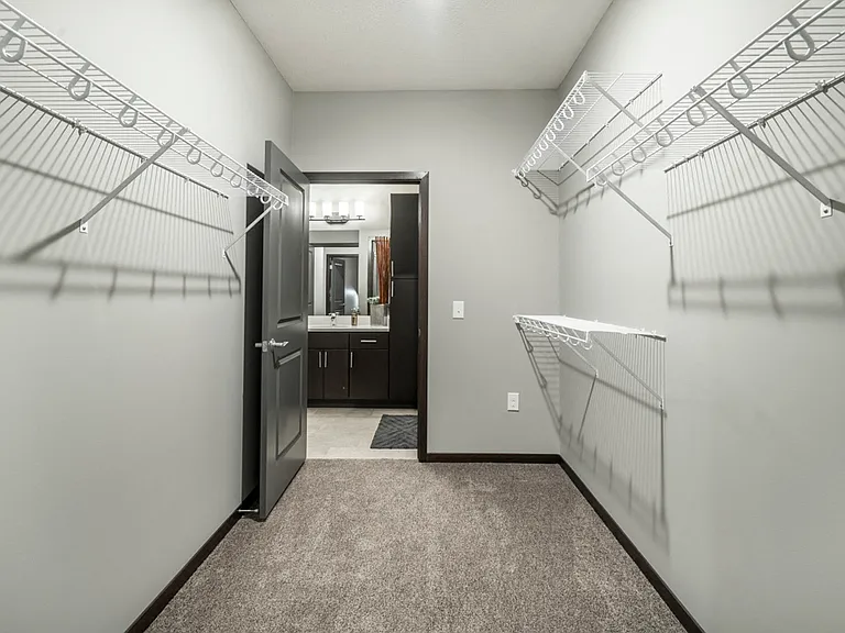 You'll have plenty of space for clothing, shoes and storage in these walk-in closets.
