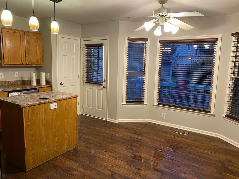 Large eat-in kitchen with pantry and access to deck.