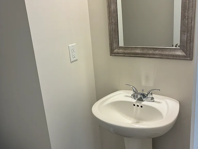 Half bath vanity entry off Kitchen and Garage