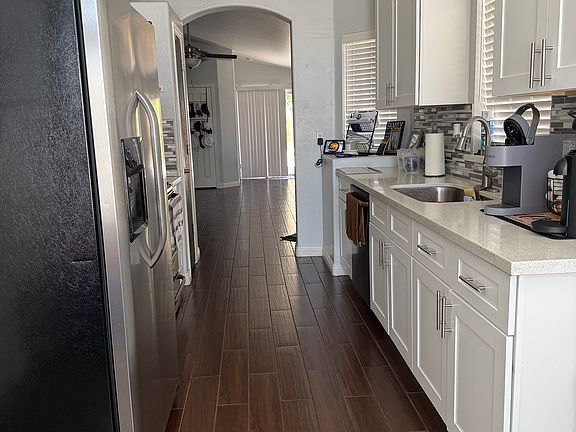 Galley kitchen, eat-in dining area at front of home