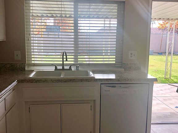 Kitchen opens to outdoor patio.