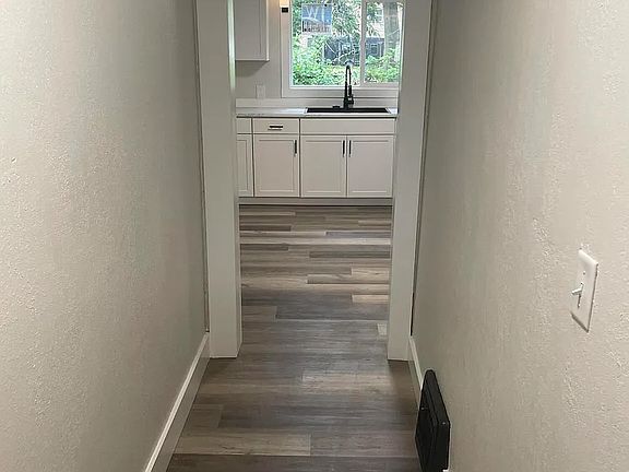 Entry hallway leading into kitchen