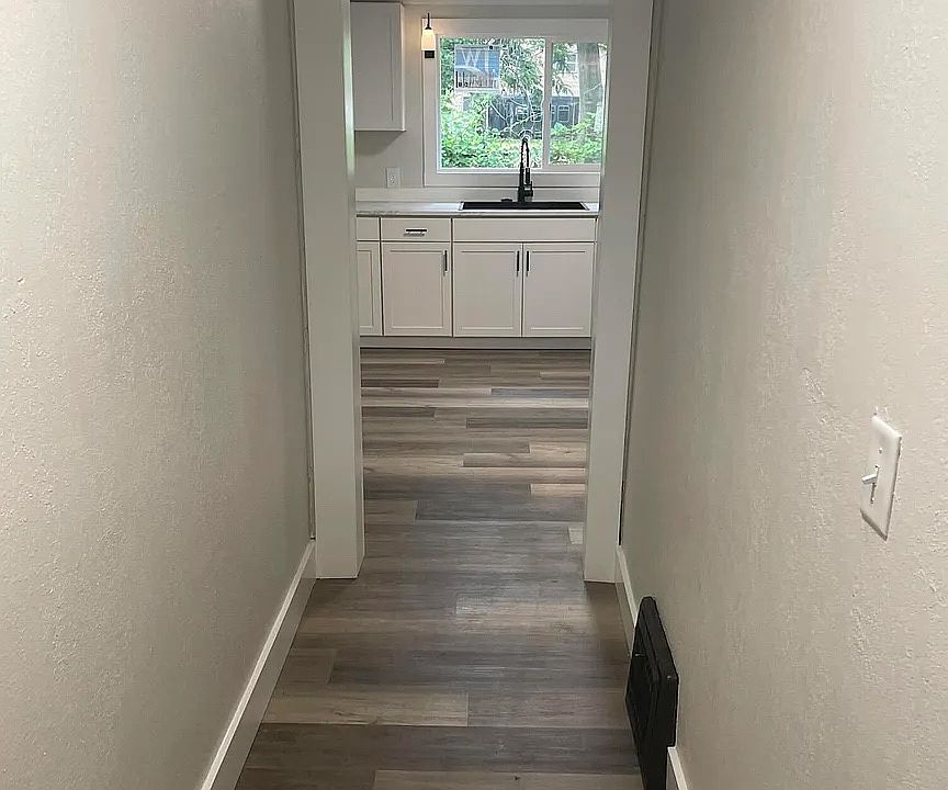Entry hallway leading into kitchen