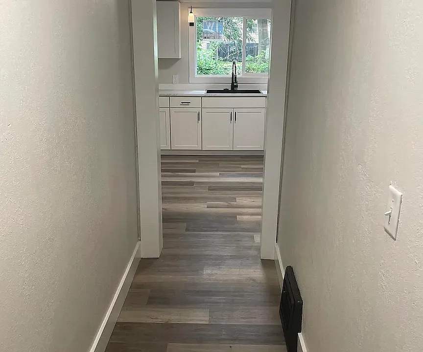 Entry hallway leading into kitchen