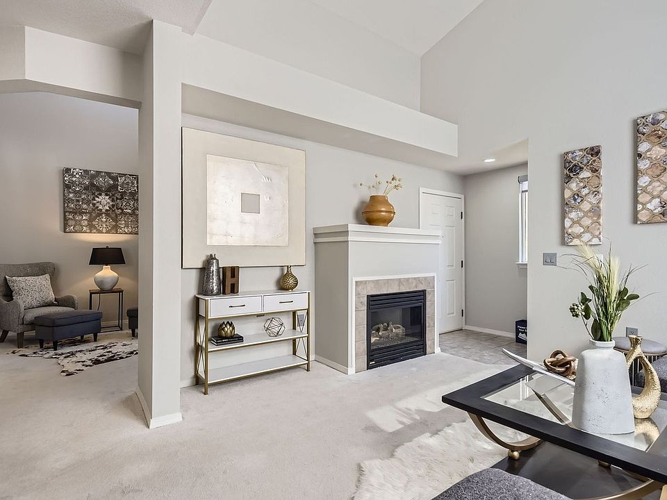 Living room and fireplace in the unit.