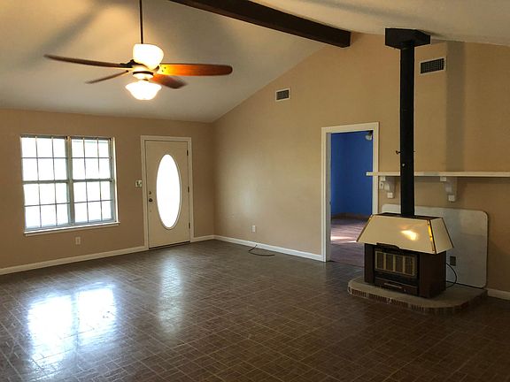 Living Room & Wood burning Fireplace with Ventilation Heater