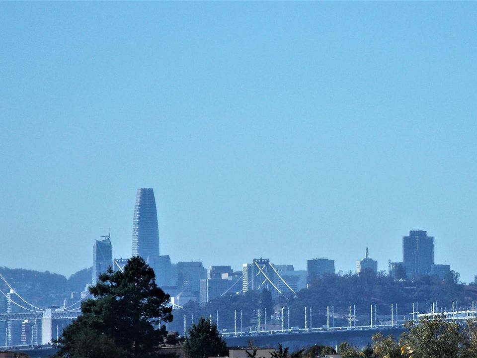 San Francisco and Bay Bridge - same view from bedroom, living room and balcony