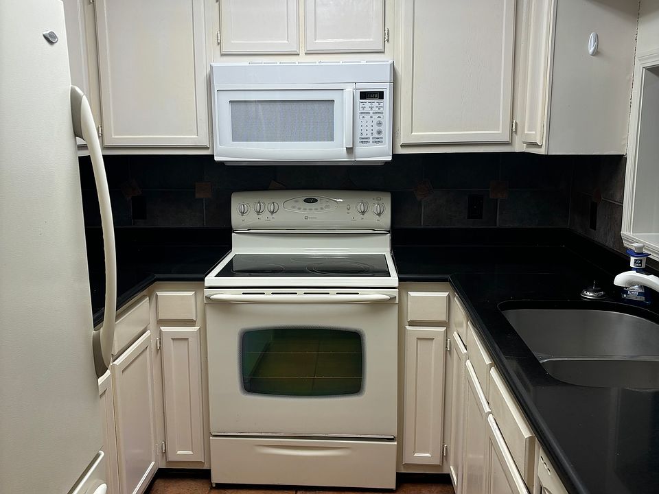 refrigerator, icemaker/freezer, range stove, microwave and dishwasher. Large double sink.
