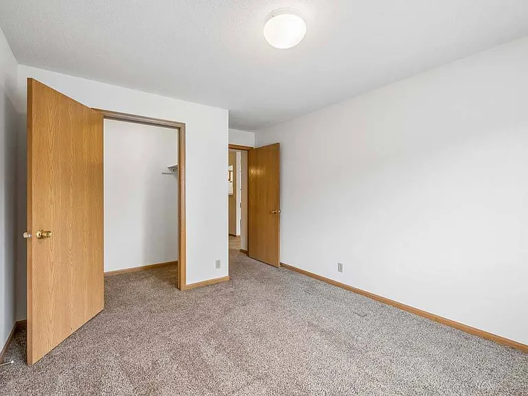 A bright, comfortable bedroom offers a peaceful retreat with a clean, versatile layout ready to suit your lifestyle.