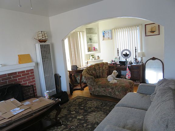 Arch to dining room, dining room with built ins.