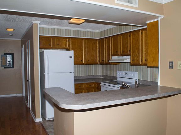 Kitchen with dishwasher, stove & refrigerator